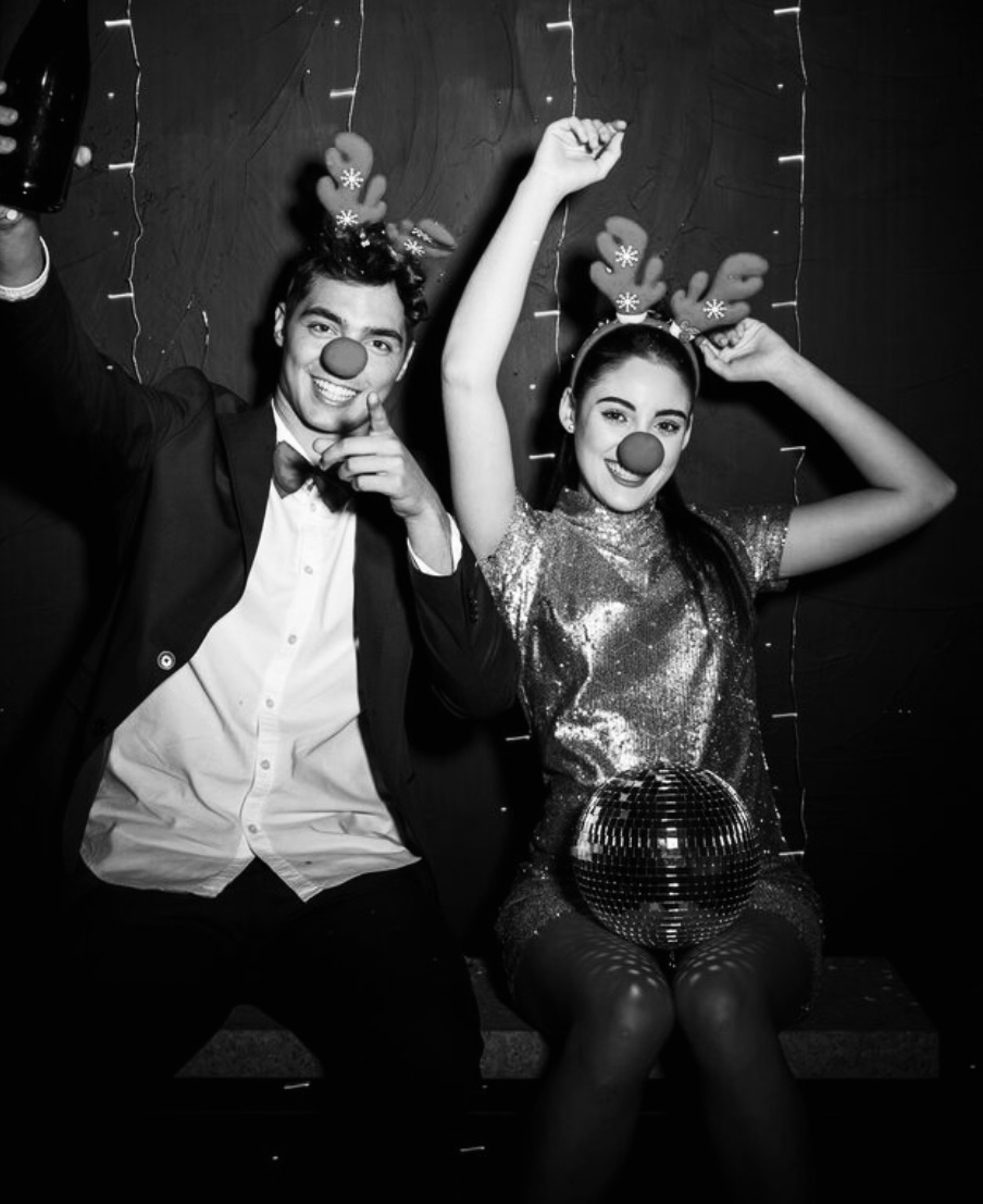 Fun couple with party props and disco ball